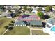 Aerial of community amenities: Tennis courts, and community center and pool, perfect for active residents at 5291 Nw 20 Pl, Ocala, FL 34482