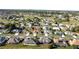 Overhead view of a beautiful home in a serene community with well-manicured lawns and tree-lined streets at 5291 Nw 20 Pl, Ocala, FL 34482