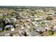 Aerial view of a well-maintained home with mature trees and landscaping in a quiet residential neighborhood at 5291 Nw 20 Pl, Ocala, FL 34482