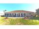 Inviting backyard features a patio, a well maintained lawn, and lush landscaping, ideal for outdoor enjoyment at 5291 Nw 20 Pl, Ocala, FL 34482