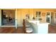 Inviting bar area with tile countertop, seating, and an open view into a comfortable living space at 5291 Nw 20 Pl, Ocala, FL 34482