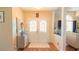 Inviting foyer with double doors, hardwood floors, and elegant decor at 5291 Nw 20 Pl, Ocala, FL 34482