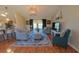 Cozy living room with hardwood floors, comfortable seating, and an open layout at 5291 Nw 20 Pl, Ocala, FL 34482