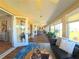 Spacious living area with hardwood floors, large windows, and seamless flow to other rooms at 5291 Nw 20 Pl, Ocala, FL 34482
