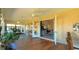 Open-concept living space with hardwood floors, a ceiling fan, and access to multiple areas in the home at 5291 Nw 20 Pl, Ocala, FL 34482