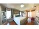 Bright main bedroom boasts hardwood floors, ample natural light, and a ceiling fan at 5291 Nw 20 Pl, Ocala, FL 34482