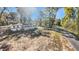 Street view of a quaint single-story home with a minimalist design and a spacious, landscaped yard at 5311 Nw 27Th Ave, Ocala, FL 34475