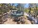 Aerial view of a single-story home with minimalist design and a lush green yard at 5311 Nw 27Th Ave, Ocala, FL 34475