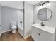 Bathroom with a tub and shower combination, modern vanity, and updated fixtures at 5311 Nw 27Th Ave, Ocala, FL 34475
