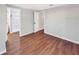 Bedroom with wood-look flooring featuring an ensuite bathroom with tub and shower combo at 5311 Nw 27Th Ave, Ocala, FL 34475