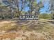 View of a charming single-story home with minimalist design, gray door and black window shutters at 5311 Nw 27Th Ave, Ocala, FL 34475