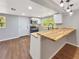 Modern kitchen featuring butcher block countertops, stainless steel appliances, and stylish pendant lighting at 5311 Nw 27Th Ave, Ocala, FL 34475