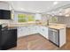 Bright kitchen features stainless steel appliances, white cabinetry, and butcher block countertops at 5311 Nw 27Th Ave, Ocala, FL 34475