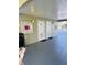 Exterior view of the pool entrance with restroom access, bulletin board, and shade at 584 Bahia Cir # B, Ocala, FL 34472