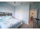 Bright bedroom with ceiling fan, closet, and comfortable bed with stylish bedding and ensuite bath at 6138 Sw 89Th Lane Rd, Ocala, FL 34476