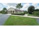 A neighborhood clubhouse featuring verdant landscaping, a sidewalk and ample parking at 6138 Sw 89Th Lane Rd, Ocala, FL 34476