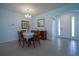 Light and airy dining room featuring tile flooring and a modern chandelier at 6138 Sw 89Th Lane Rd, Ocala, FL 34476