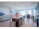 Spacious kitchen with granite island, stainless steel appliances, and view to living area at 6138 Sw 89Th Lane Rd, Ocala, FL 34476
