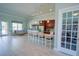 Open concept Lobby featuring a kitchenette, bar seating, and an inviting seating area at 6138 Sw 89Th Lane Rd, Ocala, FL 34476
