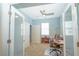 Bright home office with double doors, a ceiling fan, and neutral walls at 6138 Sw 89Th Lane Rd, Ocala, FL 34476