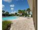 Inviting community pool surrounded by lush landscaping and comfortable lounge chairs, perfect for relaxation at 6138 Sw 89Th Lane Rd, Ocala, FL 34476