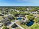 Wide aerial of the community showing the clubhouse, water feature, and surrounding residential area at 6398 Sw 108Th St, Ocala, FL 34476