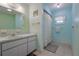 Charming bathroom with blue walls, white vanity, and shower at 6398 Sw 108Th St, Ocala, FL 34476