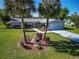 Aerial view of the front of the home with mature landscaping and a two car garage at 6398 Sw 108Th St, Ocala, FL 34476