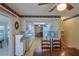 Spacious kitchen with white cabinets and appliances offers a functional layout for cooking and dining at 6398 Sw 108Th St, Ocala, FL 34476