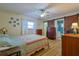 Cozy main bedroom with wood floors, barn door to bathroom and lots of natural light at 6398 Sw 108Th St, Ocala, FL 34476