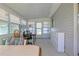 An empty sunroom with gray walls and large windows providing ample natural light at 6398 Sw 108Th St, Ocala, FL 34476