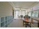 Sunroom containing tables, chairs, and windows providing ample sunlight at 6398 Sw 108Th St, Ocala, FL 34476