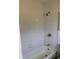 Bathroom highlighting a tub and shower with tiled walls at 6725 Nw 14Th Ave, Ocala, FL 34475