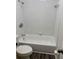 Clean white bathroom tub with shower and vinyl floors in a well-maintained space at 6725 Nw 14Th Ave, Ocala, FL 34475