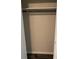 An empty closet with rod for hanging clothes at 6725 Nw 14Th Ave, Ocala, FL 34475