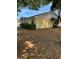 Charming single-story home features a yellow exterior, white trim, and lush landscaping at 6725 Nw 14Th Ave, Ocala, FL 34475