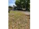 Single-story home with covered parking, driveway, and partially-shaded front yard at 6725 Nw 14Th Ave, Ocala, FL 34475