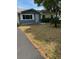 Charming single-story home with a well-manicured lawn and paved driveway at 6725 Nw 14Th Ave, Ocala, FL 34475