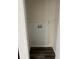 Small, functional laundry closet with hookups and dark wood-look flooring at 6725 Nw 14Th Ave, Ocala, FL 34475