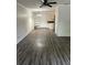Open living space with wood-look floors and connection to the kitchen area at 6725 Nw 14Th Ave, Ocala, FL 34475
