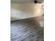 Spacious living room with modern flooring and ceiling fan for comfort at 6725 Nw 14Th Ave, Ocala, FL 34475