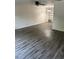 Cozy living room with ceiling fan, stylish wood-look floors, and neutral paint at 6725 Nw 14Th Ave, Ocala, FL 34475