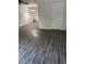 Inviting living area with stylish wood-look floors, built-in shelves, and neutral tones at 6725 Nw 14Th Ave, Ocala, FL 34475