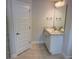 Bathroom features a modern vanity, a large mirror, and a tiled shower at 71 Nw 42Nd Pl, Ocala, FL 34475