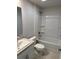 The bathroom features a shower and bathtub combination, updated sink, and granite countertop at 71 Nw 42Nd Pl, Ocala, FL 34475