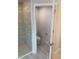 The bathroom features a glass-enclosed walk-in shower and tile flooring at 71 Nw 42Nd Pl, Ocala, FL 34475