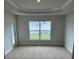 A cozy bedroom with large window and natural light at 71 Nw 42Nd Pl, Ocala, FL 34475
