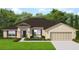 Charming single-story home with a well-manicured lawn and attached two-car garage at 71 Nw 42Nd Pl, Ocala, FL 34475