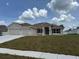 Charming single-story home featuring a well-manicured lawn and a two-car garage at 71 Nw 42Nd Pl, Ocala, FL 34475