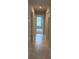Hallway featuring tile flooring and an open view into the living space at 71 Nw 42Nd Pl, Ocala, FL 34475